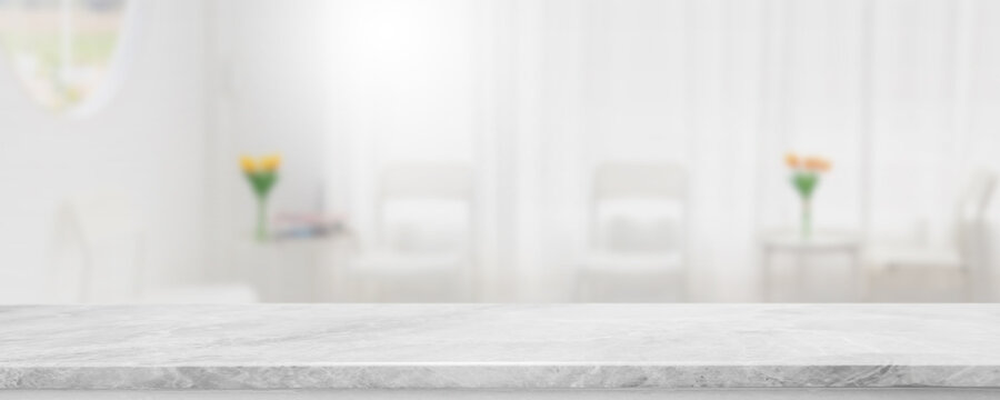 Empty white marble stone table top and blur glass window interior restaurant banner mock up abstract background - can used for display or montage your products.