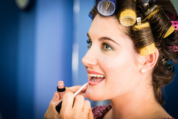 Woman makeup session on her wedding day