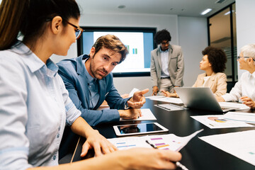 Group of business people working together, brainstorming in office