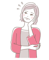 頬に手を当てて困った表情の中年女性