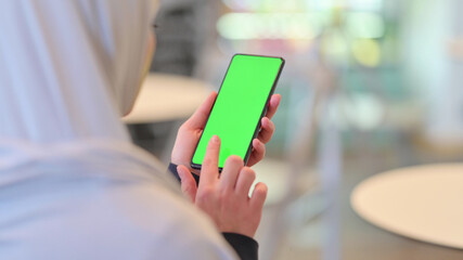 Arab Woman Using Smartphone with Green Chroma Screen 