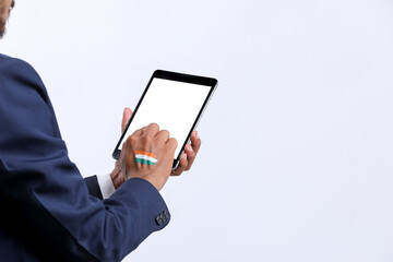 Young indian businessman using tablet over white background.