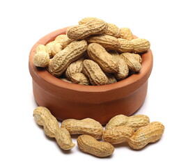 Shelled peanuts in clay bowl isolated on white background