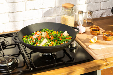 Cooking a vegetarian dinner  in a pan on gas plate