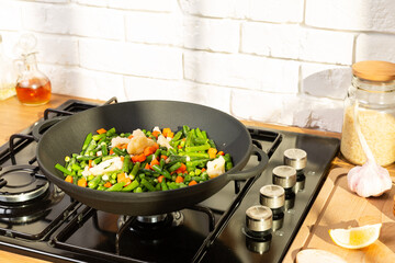 Cooking a vegetarian dinner  in a pan on gas plate