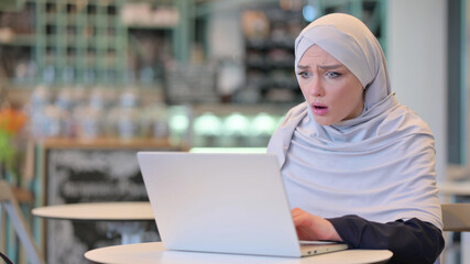 Upset Young Arab Woman having Loss on Laptop 