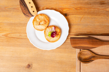 Tasty hot cheesecake women put on the white plate