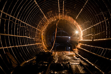 Abandoned subway tunnel construction. Deep metro line construction. Old mine for the construction of the subway