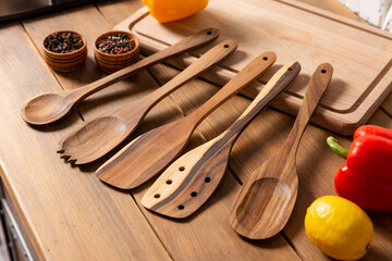 Set of wooden kitchen equipment on rustic background