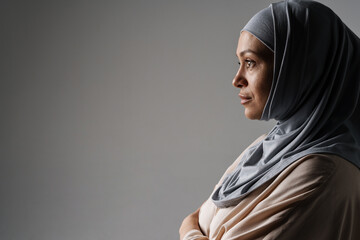Middle eastern woman in hijab posing and looking aside