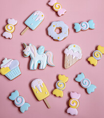Colorful gingerbread cookies in colored glaze of different shapes.