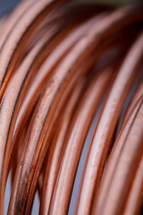Copper wire non-ferrous metals, product metalworking industry. Abstract metal shapes.