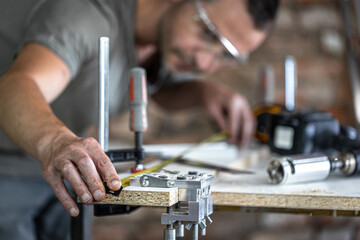 Obraz na płótnie Canvas Universal furniture manufacturer, professional precision drilling tool.
