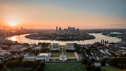 Sunset Aerial bird's eye view photo taken by drone of Greenwich park with views to Canary Wharf, Isle of Dogs, London, United Kingdom - obrazy, fototapety, plakaty