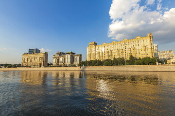 Fototapeta na wymiar Moskva River and urban architecture of the capital downtown on a summer day. Moscow, Russia