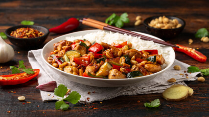Kung Pao Chicken with Peppers, zucchini and rice. Asian take away food