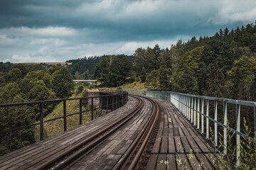 old railway viaduct in the mountains, stone bridge, empty railway