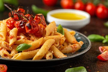 Baked sweet cherry tomatoes and Greek feta cheese fussily pasta. Trendy Vegetarian food