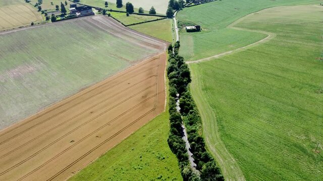 4K drone video in a tree lined country road in Kent, England