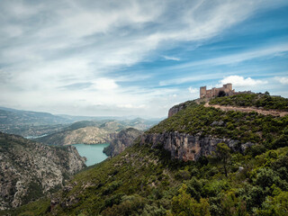 Fototapeta na wymiar Paisaje desde lo alto con el rio y el castillo de Chirel perteneciente a Cortes de Pallas situado por la provincia de Alicante en España