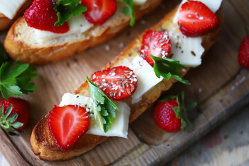 Delicious toast with strawberries and white cheese. Keto toast with strawberries.
