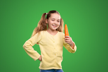 Cheerful girl with fresh carrot