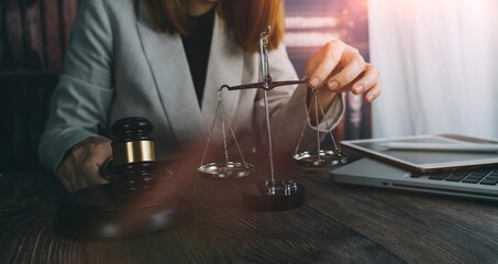 justice and law concept.Male judge in a courtroom on wooden table and Counselor or Male lawyer working in office. Legal law, advice and justice concept.