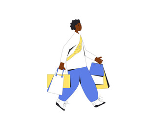 Young man with shopping bags. Male person walking with his purchases.