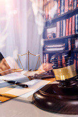 Business and lawyers discussing contract papers with brass scale on desk in office. Law, legal services, advice, justice and law concept
