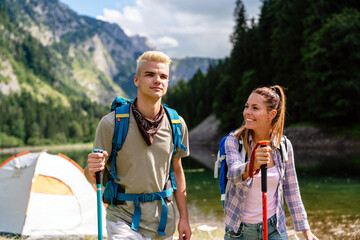 Group of happy hiker friends trekking as part of healthy lifestyle outdoors activity