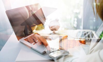 Fototapeta premium businessman holding coins putting in glass and using calculator. concept saving money and finance accounting.
