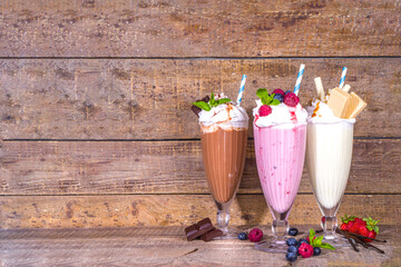 Summer refreshing drinks, milkshakes, crazy shakes with ice cream, berries, vanilla, chocolate. On...