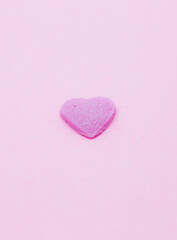 Obraz premium Pink heart on pink background. Saint Valentine's day concept. Love and romantic photo. Postcard for holiday. Beautiful warm wallpaper with love. Soft focus. Copy space.