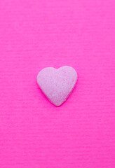 Pink heart on pink background. Saint Valentine's day concept. Love and romantic photo. Postcard for holiday. Beautiful warm wallpaper with love. Soft focus. Copy space.