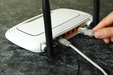 Wi - fi connection concept on black smokey table, close up