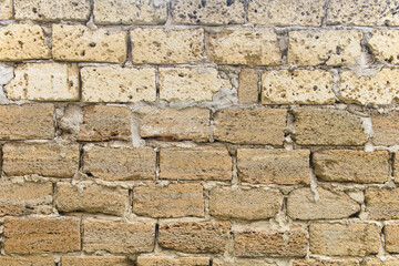 A wall made of bricks made of shell rock