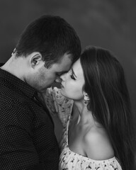 Close up sensual portrait of young couple in love, together, face to face. Black and white