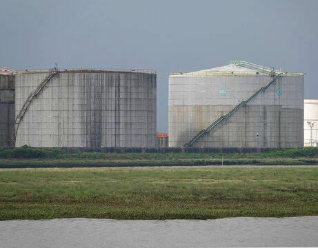 Oil Storage Tanks Outside Under A Gloomy Sky In A Refinery Base