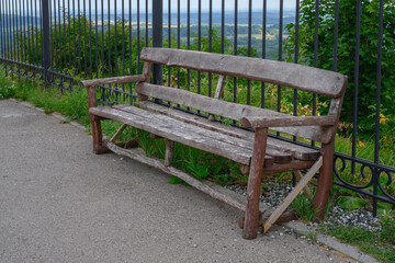 An old wooden bench on Belaya Gora (Perm Territory, Russia). close-up. Steep descent down. In the...