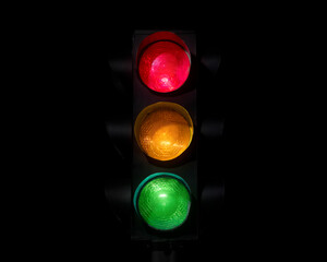 Traffic light on completely dark background