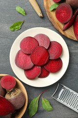 Fresh chopped beets on gray wooden table