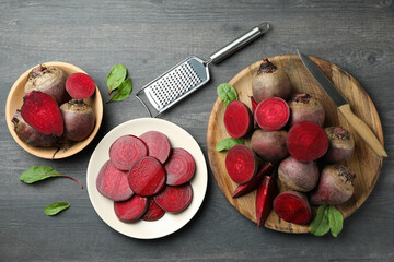 Fresh chopped beets on gray wooden table