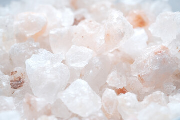 Fototapeta na wymiar close up of pink rock salt in a bowl on table 