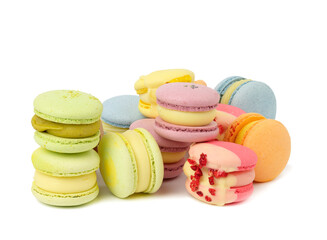 baked multicolored macarons with different flavors on white isolated background
