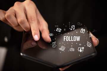 Businessman holding a foldable smartphone, social media concept