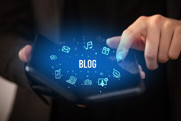 Businessman holding a foldable smartphone, social media concept