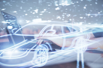 Double exposure of woman hands typing on computer and automobile theme drawing. High Tech concept.