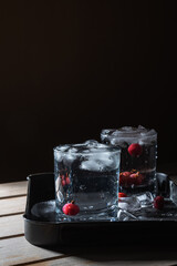Glass of cold water with ice on a table