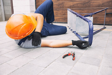 The worker fell down from the ladder while working near the house