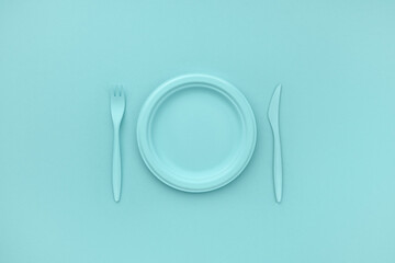 Empty plate and cutlery. Monochrome blue color. Minimalistic concept. Breakfast, lunch, dinner.